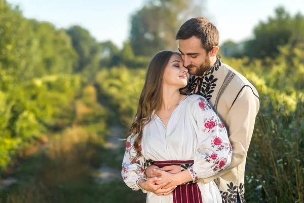 Beautiful couple in field — Stock Photo, Image