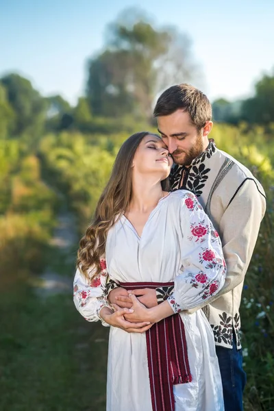 Beautiful couple in field — Stock Photo, Image