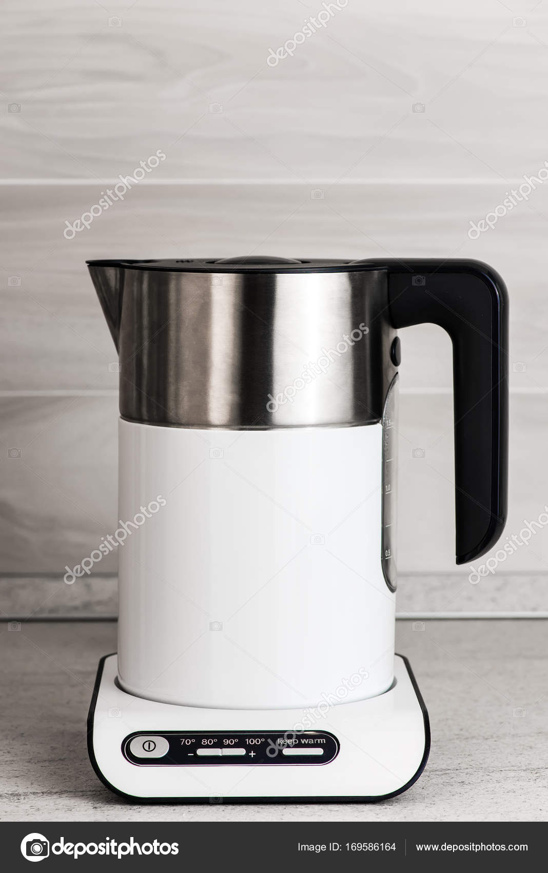 White modern electric kettle in the kitchen Stock Photo by ©Svyatkovsky  169586164