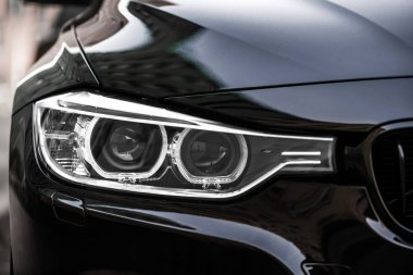 Close-up photo of car headlights clipart
