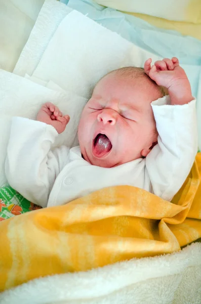 A little baby is stretched in the morning in bed — Stock Photo, Image