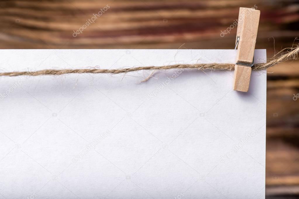 Photo frame, notes. Business photo frame with isolated white texture. Blank photo frame. White sheets on clothes-peg. Wood background. Ideal for business, notes, sales
