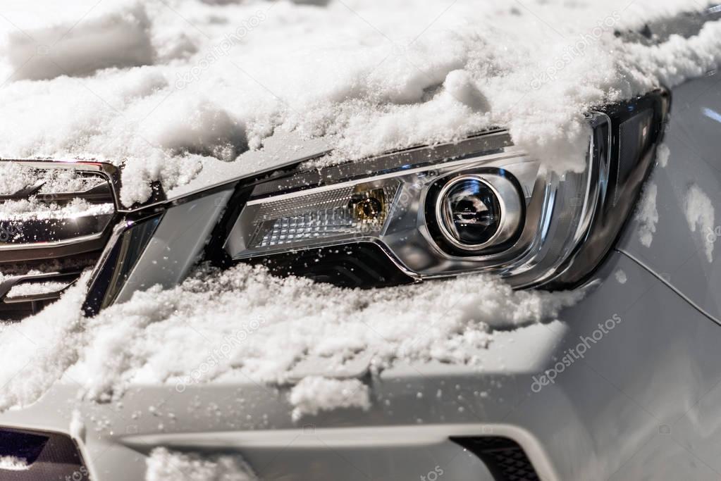 Car lights under the snow