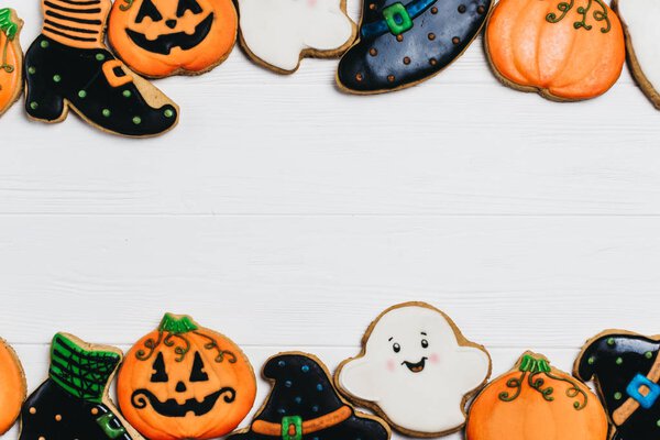 Funny delicious ginger biscuits for Halloween on the table. horizontal view from above