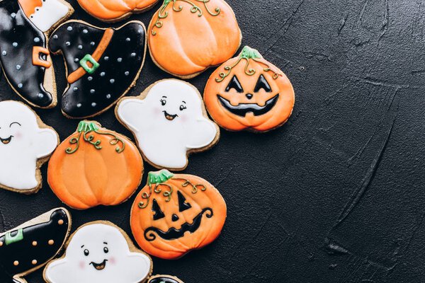 Funny delicious ginger biscuits for Halloween on the table. horizontal view from above