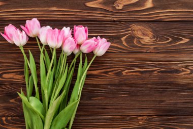 Bouquet of beautiful tulips on wooden vintage background