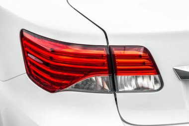 Closeup backlamp of a white luxury car.- Image