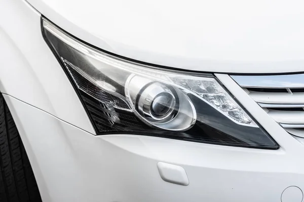 Closeup headlamp of a white luxury car.- Image — Stock Photo, Image