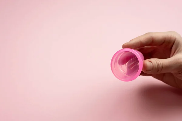 Close-up of young woman hands folding a menstrual cup. — Stock Photo, Image