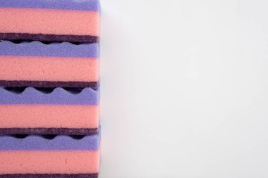 Multi-colored sponges for washing dishes isolated on a white bac