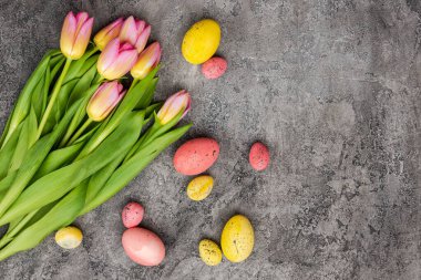bouquet of tulips and colorful eggs