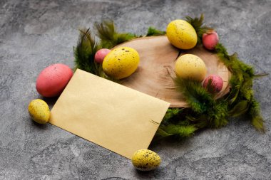 Empty mockup  blank on a  Easter background. Colorful eggs and f