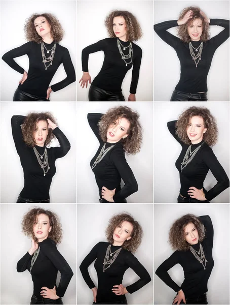 Happy young woman with black blouse against white wall. Young woman with long curly hair posing in studio against white wall — Stock Photo, Image