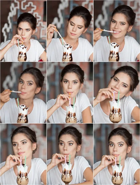 Fashionable attractive lady with T shirt  standing near a restaurant table having a drink and smile. Short hair brunette woman with makeup and creative haircut holding a glass with fresh