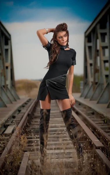 Attractive Woman Short Black Dress Long Leather Boots Standing Rails — Stock Photo, Image