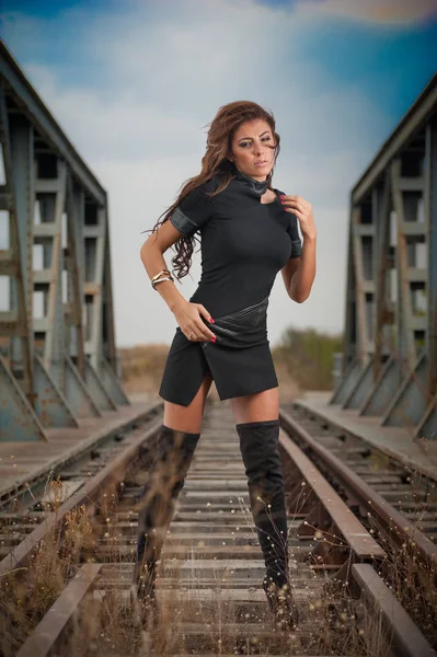 Attractive Woman Short Black Dress Long Leather Boots Standing Rails — Stock Photo, Image