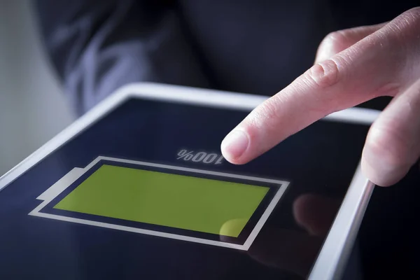 Finger touches digital tablet — Stock Photo, Image