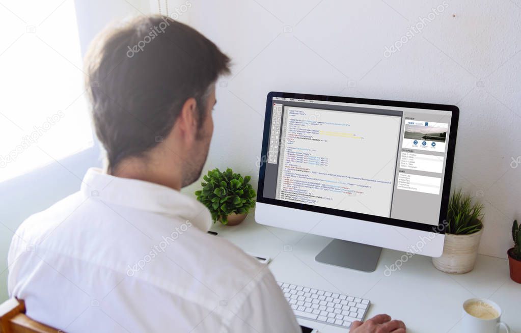 man programming a website