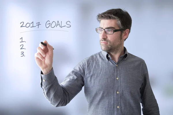 Businessman drawing goals — Stock Photo, Image