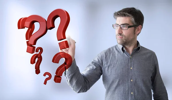 Businessman touching question marks — Stock Photo, Image