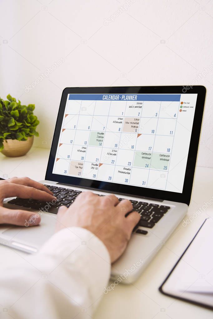 man managing a calendar 