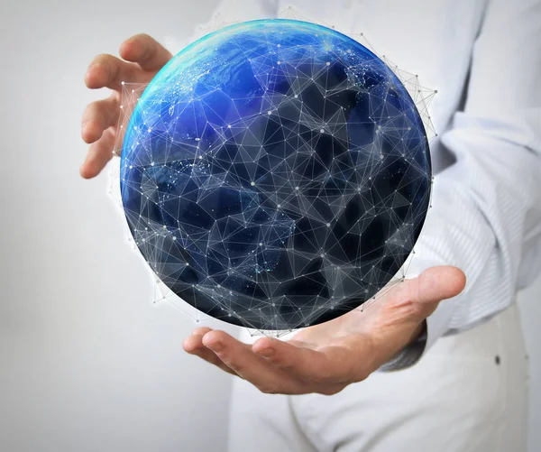 Earth with network between hands — Stock Photo, Image