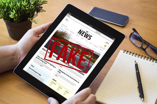 Man holding a fake news device — Stock Photo, Image