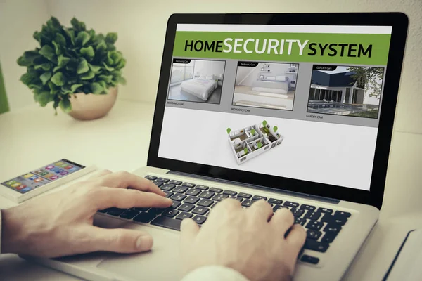 Man using laptop with cctv on screen — Stock Photo, Image