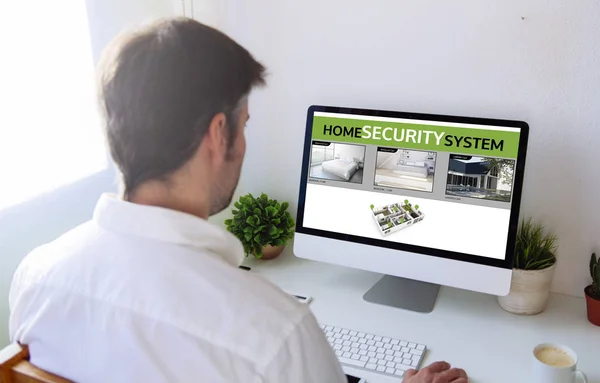Man viewing security cams videos — Stock Photo, Image