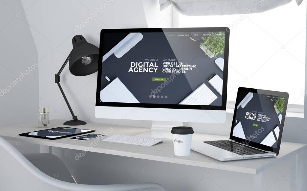 devices with agency website design on screens 