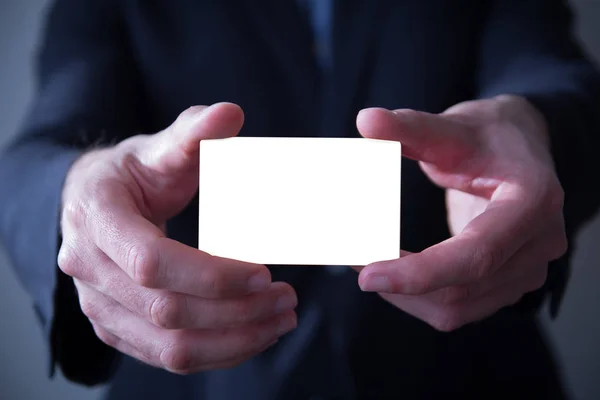 Businessman holding business card — Stock Photo, Image