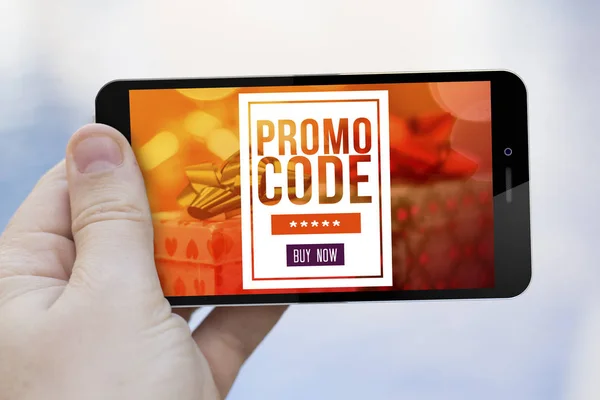 mobile marketing concept: man using smartphone with gift voucher on screen