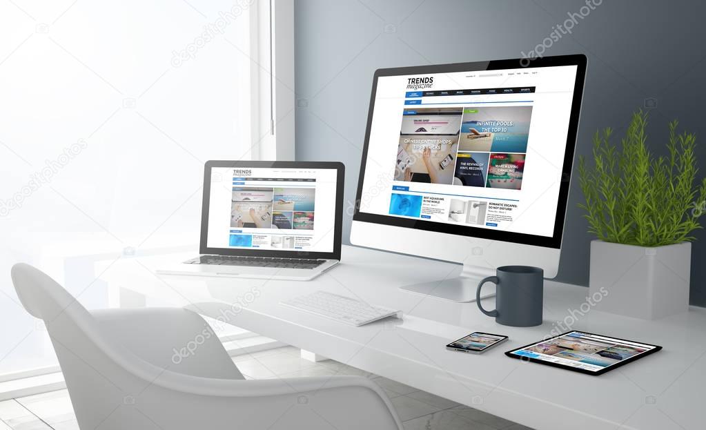 computer, laptop, smartphone and tablet pc on workspace with online magazine website on screens, 3d rendering