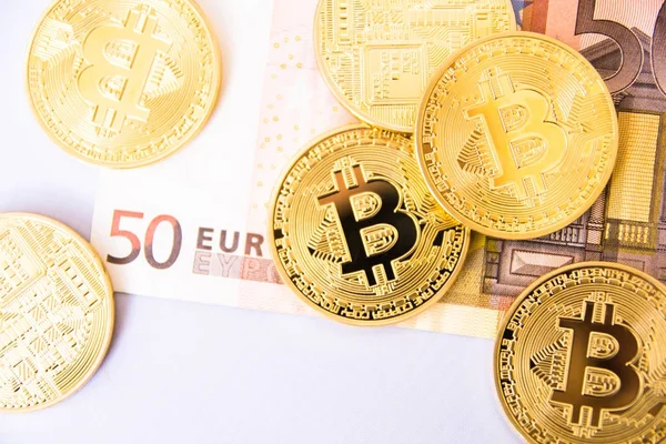 Bitcoins over euro bill — Stock Fotó