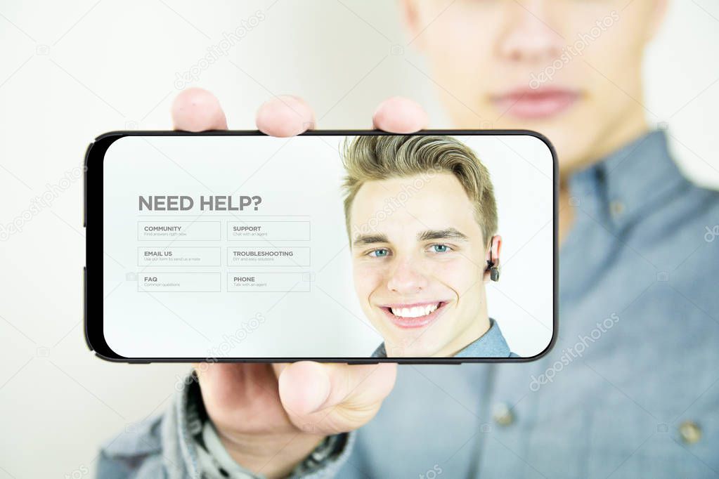 young man holding and showing customer support website on smartphone