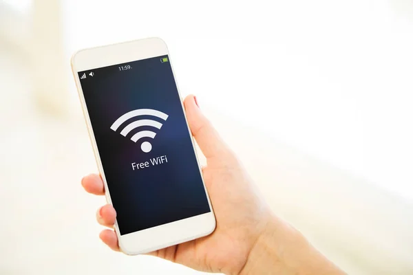 Female Hand Holding Smartphone Showing Free Wifi Sign — Stock Photo, Image