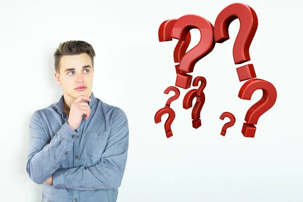 Young Man Thinking Question Marks Floating — Stock Photo, Image