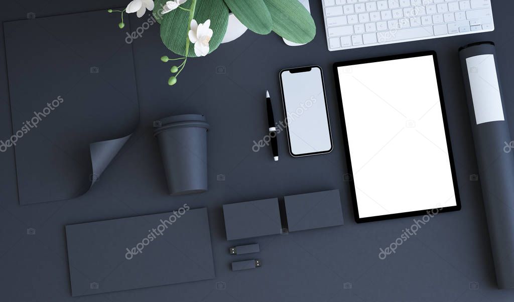 top view of corporate identity products on black surface