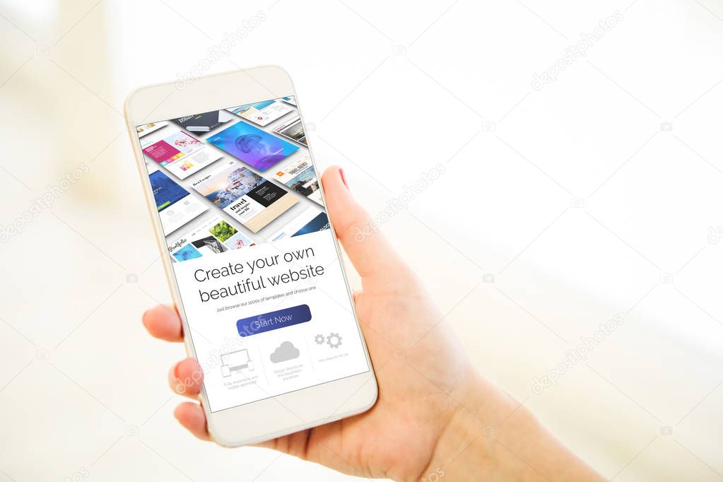 Woman holding a gold generic smartphone showing website builder