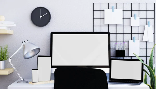Modern and minimalist desk with different devices and an moadboard with paper clips mock up