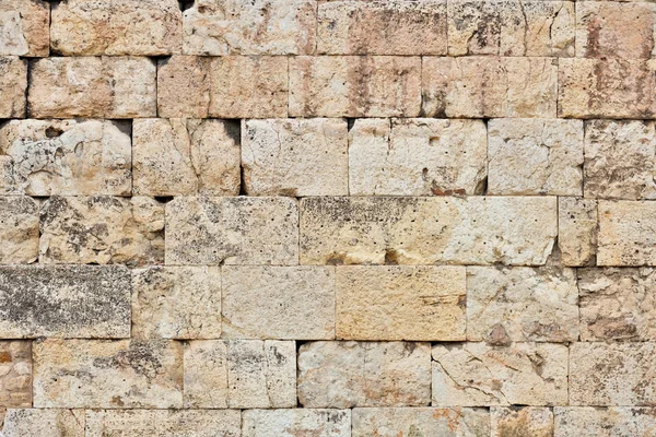 Alte Steinblockmauer als Hintergrund — Stockfoto