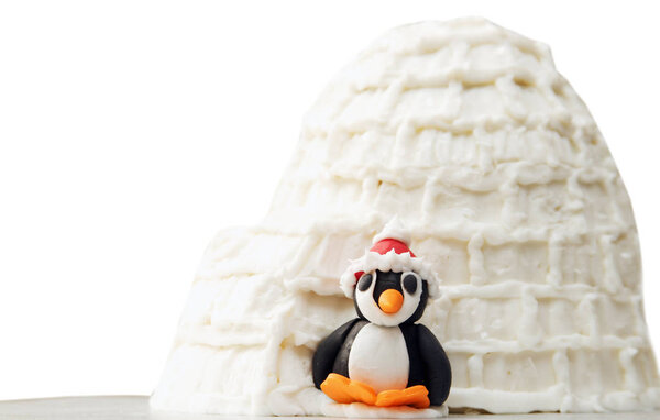 Penguin winter scene food sculpture. 