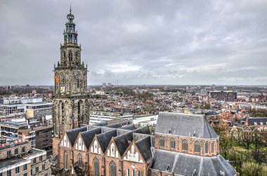 Groningen, The Netherlands, December 7, 2019: view from the roof of the new Forum building towards Saint Martin's church and the northern parts of the town clipart