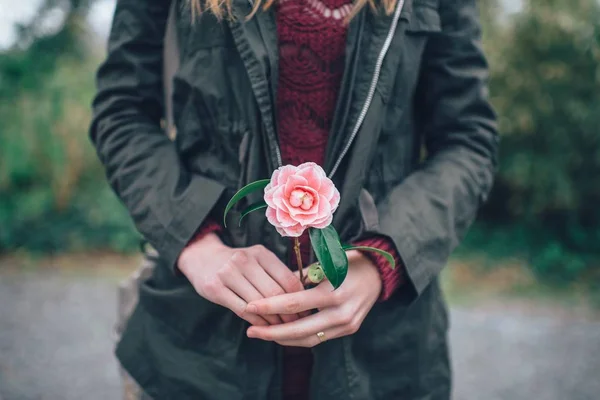 Woman with rose flower