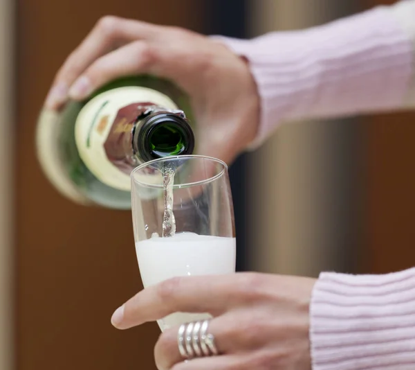 close-up photo of open Champagne Bottle on blurred background