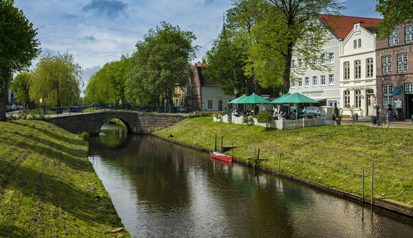 picturesque view of colorful houses near river, Friedrichstadt In Schleswig Holstein