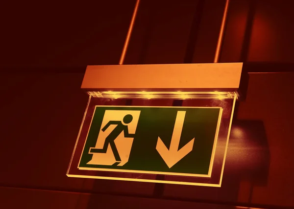 close-up photo of Sign For Emergency Exit