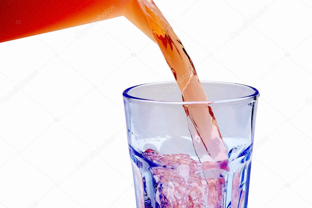 Beverage Pouring Into Glass isolated on white background, close-up 