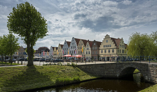 picturesque view of colorful houses near river, Friedrichstadt In Schleswig Holstein