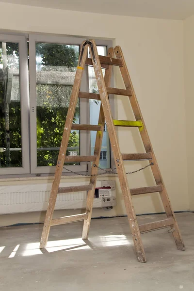 wooden ladder in empty room,  repair concept